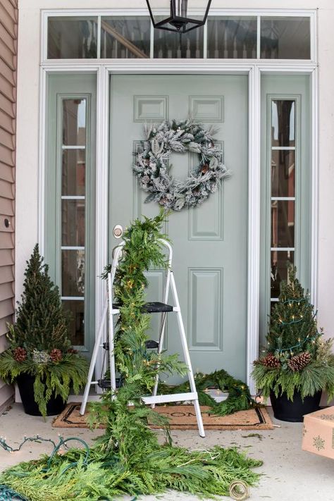 Garland Around Front Door, Outdoor Christmas Garland, Porch Garland, Evergreen Garland, Elf On The Shelf Arrival, Outdoor Garland, How To Make Garland, Front Gardens, Miss Mustard Seed