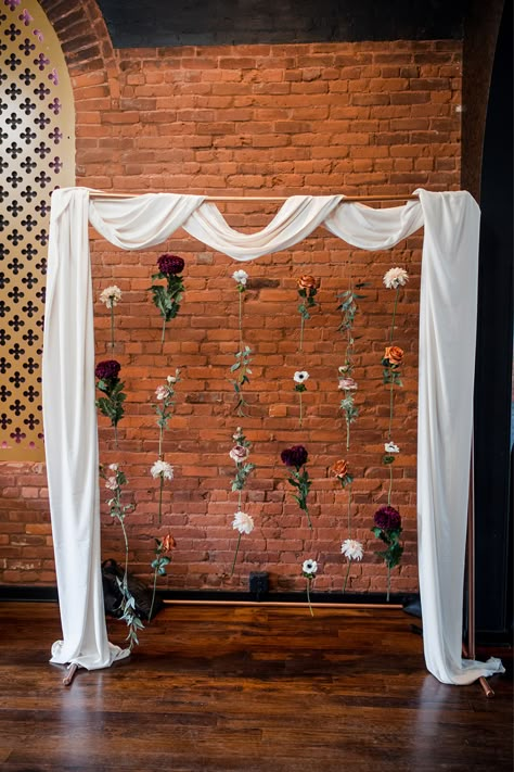 photo backdrop with white draping and hanging flowers Romantic Photo Backdrop, Hanging Wedding Backdrop, Drape Photo Backdrop, Wedding Alter Background, Wedding Flower Curtain, Fall Wedding Photo Backdrop Diy, Easy Diy Photo Backdrop Wedding, Simple Diy Backdrop, Flower Hanging Backdrop