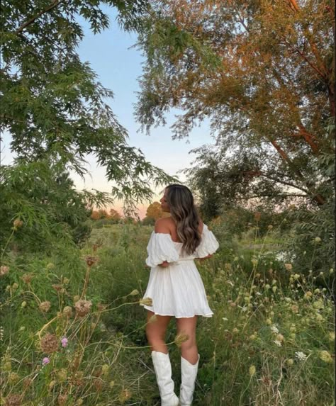 Short Flowy Dress With Cowboy Boots, Country Outfit White Boots, Outfits With White Cowgirl Boots Summer, White Dress With White Cowboy Boots, White Cowboy Boots Wedding Dress, Plus Size White Cowboy Boots Outfit, Sundress And Boots Outfit, Senior Pictures With Cowboy Boots, Cowgirl Boot Senior Pictures