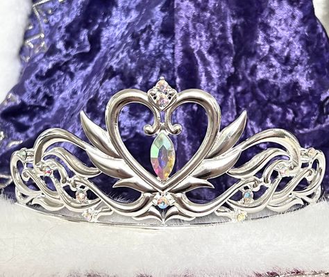 "This stunning Serenity Queen inspired tiara is made of gorgeous bright gold colored metal which is detailed with a large winged heart. Accented with red and clear crystals. Tiara measures 2.5\" tall in center. It has loops at the end of it to pin into your hair or wig. Perfect to complete your Serenity costume or cosplay. This Tiara has been redesigned for better proportions and ease of wear! Also available in Gold https://www.etsy.com/RoyalEnchantments/listing/985186298/serenity-neo-queen-moon Animecore Fashion, Moon Tiara, Tiara Design, Sailor Moon Wedding, Headband Design, Princess Crowns, Sailor Moon Shirt, Tiara Silver, Crown Queen