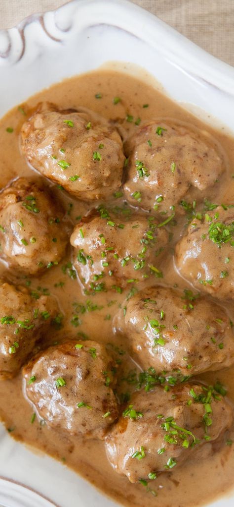 Truly the BEST Swedish meatballs! Made from a mixture of beef and pork, flavored with nutmeg and cardamom and served with a rich beef and sour cream gravy. On SimplyRecipes.com Sour Cream Gravy, Best Swedish Meatball Recipe, Best Swedish Meatballs, Swedish Meatball Recipe, Beef And Pork Meatballs, Swedish Meatballs Recipe, Meatball Stroganoff, Cream Gravy, Beef And Pork