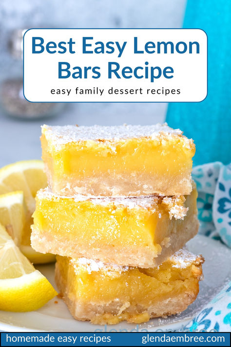 Three lemon bars stacked on a white ceramic plate with lemon wedges on the side. Best Ever Lemon Bars Recipe, Sunny Anderson Lemon Bars, Quick And Easy Lemon Bars, Lemon Bars With Pretzel Crust, How To Make Lemon Bars, Lemon Refrigerator Bites, Easy Pan Of Bars, Lemon Bar Recipe Easy, Best Lemon Bar Recipe