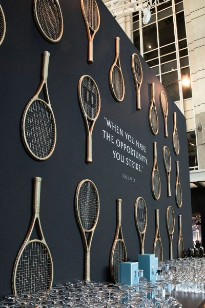 Tennis rackets adorn this custom bar | Luxury wedding, luxury event planner, event planner, event design, wedding inspo, wedding inspiration, event inspiration, chicago wedding, wedding details, wedding tablescape, modern wedding, wedding reception decor, floral design, wedding decor, chicago wedding venue, outdoor wedding reception, suprise birthday party ideas, birthday party decor, event decor, outdoor event reception, classic wedding decor, 2022 wedding trends, wedding tablescapes Event Decor Outdoor, Tennis Court Design, 2022 Wedding Trends, Classic Wedding Decor, Bar Luxury, Photowall Ideas, Suprise Birthday, Wedding Venue Outdoor, Tennis Event