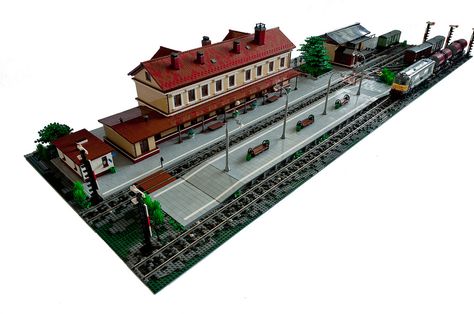 OK, here it goes. It's about 40-50% of my train station project. To be honest, the work is still in progress. The station for sure needs some life on it and at least one passenger train. It also needs some stickers here and there and tiny little details. And of course last but not least - lights :)  The main building is a modified version of my train station from Klocki Zdrój 2008. Then it was placed on 4 48x48 baseplates. It was too big and this was causing a lot of problems from mainten... Lego Train Station, Lego City Train, Lego Train Tracks, Lego Train, Lego Buildings, Lego Inspiration, Lego Modular, Lego Trains, Train Stations