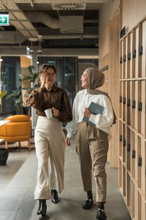 Two women walking down a hallway in an office building · Free Stock Photo People In Office Photography, Office Workers Photography, Working With Women, Casual Corporate Photoshoot, Office Photo Shoot Ideas, Office Team Photoshoot Ideas, Company Group Photo, Group Office Photos, Office Shoot Ideas