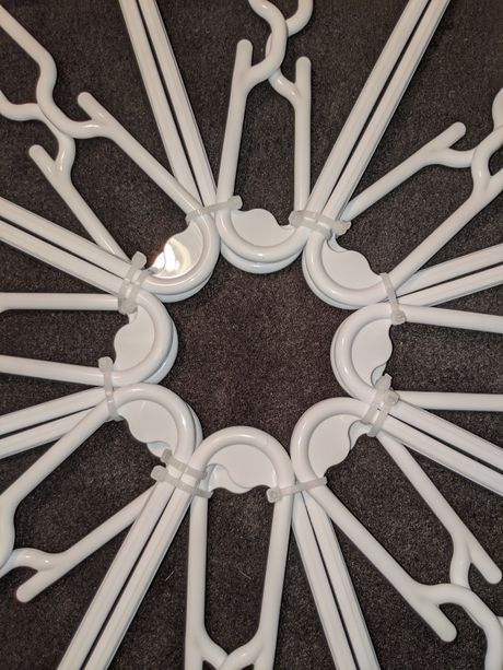 White Plastic Hanger Snowflakes, Clothes Hanger Christmas Star, Stars From Hangers, Dollar Tree Hanger Snowflake, Snowflake From Hangers, Hangers Crafts Ideas, Coat Hanger Star Diy, Star Made Out Of Plastic Hangers, Diy Hanger Snowflake