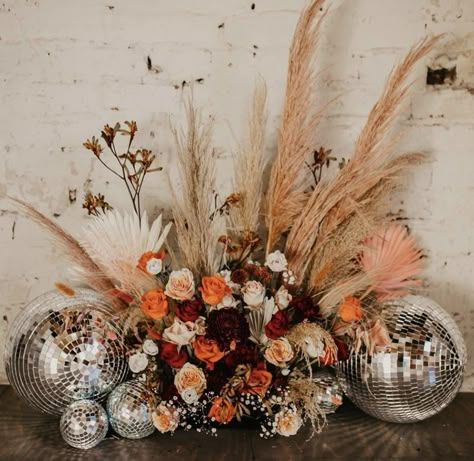 Roller Disco Wedding Inspo Pampas Grass And Disco Balls, Pampas Disco Ball, Mirror Ball Wedding Decor, Disco Ball Arrangement, Rustic Disco Wedding, Fall Disco Wedding, Desert Disco Wedding, Western Disco Wedding, Disco Ball And Flowers