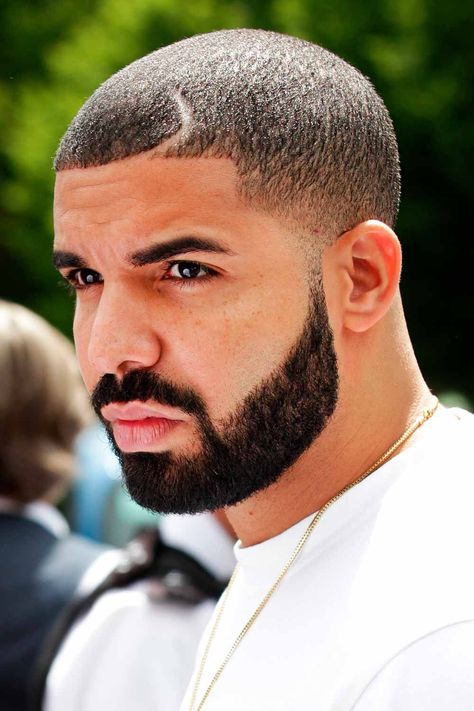 When you think of a Drake haircut, you can hardly name one only. The rapper changes his style pretty often. Among his most popular 2022 hair looks are Drake waves, a heart design, a line up and an Afro fade. Find more ideas here. #menshaircuts #menshairstyles #drake #drakehair #drakehaircut Drake Beard, Hair Parts, Braid Hairstyle Ideas, Hairstyles For Receding Hairline, Drake Photos, Champagne Papi, Buzz Cut Hairstyles, Drizzy Drake, Drake Graham