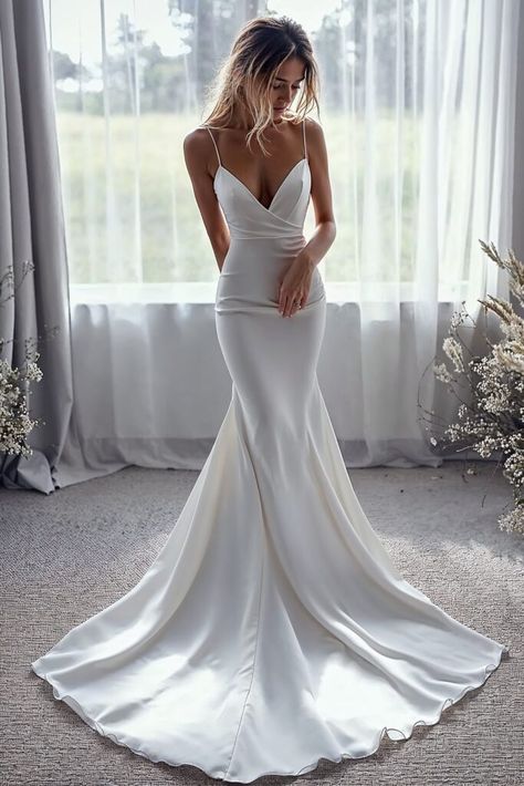 15 Minimalist Wedding Dress Ideas for Effortlessly Chic Brides Body Fitted Wedding Dress, Mermaid Wedding Dress Minimalist, Chic Classic Wedding Dress, Elegant Wedding Dress V Neck, Low Back Trumpet Wedding Dress, Beachside Wedding Dress, Sleek Low Back Wedding Dress, Slim Fit Lace Wedding Dress, Fit And Flow Wedding Dress