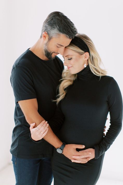 Couples Maternity Photography Studio, Maternity Poses For Couples, Maternity Shoot Poses Indoor, Maternity Pictures White Dress With Husband, Pregnant Couple Studio Photoshoot, Maternity Pictures Poses Couple, Couple Maternity Poses At Home, Maternity Shoot Couples Outfit, Poses For Pregnant Couples