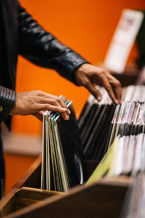 A anonymous man searching the stacks for vinyl records at a music store. This image is exclusively licensable as a royalty-free stock photo through Stocksy United.  #StockPhoto #RecordStoreDay #VinylRecords #music Vinyl Shop Photoshoot, Record Store Shoot, Music Records Aesthetic, Music Store Aesthetic, Records Aesthetic, Vinyl Painting, Vinyl Paintings, Coffee Interior, Love Radio