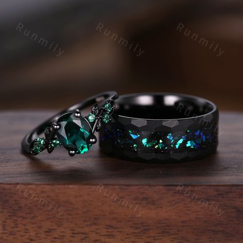 Here we have a Oval cut emerald couples ring set black gold matching promise ring His and Her wedding band Mens hammered tungsten ring anniversary gifts ITEM DESCRIPTION ✦ Handmade, high-quality item! ✦ Material: Sterling Silver/Solid Gold/Tungsten ►Sold as a two-piece set ►His ring is Black Tungsten Carbide with blue green opal. ►His band width: 8mm ►His tungsten ring will not turn green itself and will not cause your skin to turn green.  ✦ Durable - Incredibly Scratch-Resistant to always look Engagement Rings Men And Women, Ring Sets Wedding His And Hers, Wedding Rings Sets His And Hers Black, Black Matching Wedding Rings, Cool Wedding Rings For Men, Men Wedding Bands Black, Alt Wedding Rings, Black Green Wedding, Boy Rings