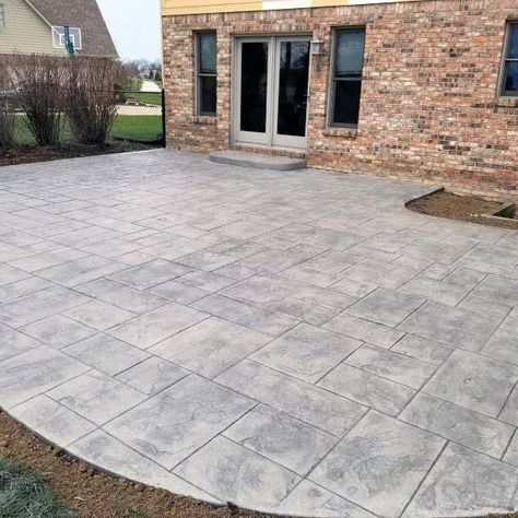 Top 50 Best Stamped Concrete Patio Ideas - Outdoor Space Designs Back Patio Stamped Concrete, Concrete Patio Next To Deck, Paver Concrete Patio, Decorative Cement Patio, Stamped Concrete Patio With Border, Concrete Design Patio, Concrete Patio Tiles, Dark Gray Stamped Concrete Patio, Stamped Concrete Patio Shapes