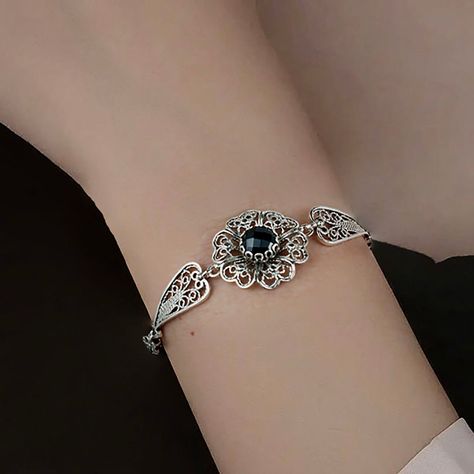 Unveil the elegance of midnight with every flick of your wrist 🌸✨. Our Black Onyx Gemstone Clover Flower Bracelet is a filigree masterpiece that sits pretty on your arm, waiting to cast its charm. Whether you're choosing a Thanksgiving blessing or seeking a memorable birthday surprise, this link bracelet is the whisper of luxury she deserves. Tap to indulge in the enchanting artistry or gift a touch of magic today! 💫🎁 #GemstoneGlamour #CharmHerHeart Find your next treasure here 👉 [https://nu... Filigree Silver Jewelry, Silver Bracelet Designs, Flower Woman, Art Jewelry Design, Cherry Quartz, Bracelets Design, Clover Flower, Magical Jewelry, Bracelet Diy