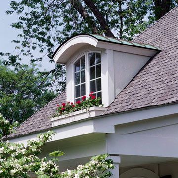 Arched Shed Dormer Window with Copper  The first inclination may be to cover a new dormer top with shingles used elsewhere on the roof, but it's an excellent chance to introduce a new material.  This arched shed dormer window is dressed up with copper roofing material to tie in with hardware found elsewhere on the exterior, and the window box was constructed to match ones gracing windows on the main level. Dormer Window Ideas, Dormer Ideas, Versetta Stone, Dormer Roof, Dormer Window, Exterior Entrance, Shed Dormer, Vinyl Exterior, Copper Roof