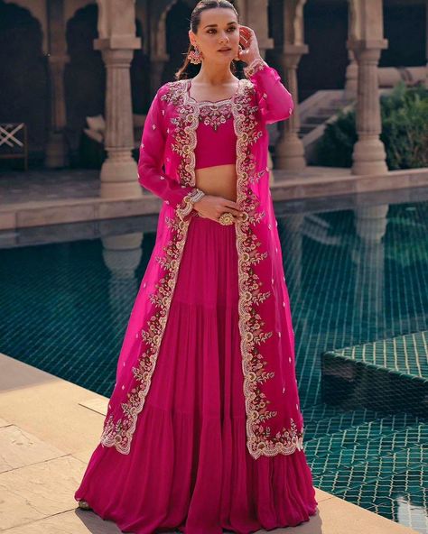 Party Wear Lehenga Choli With Long Shrug Style Koti https://www.urmifashion.com/lehengas/koti-style-lehenga-choli/rani-pink-real-chinon-silk-koti-style-lehenga-choli-uf167-3 #lehenga #lehengacholi #lehengacholionline #lehengas #lehengalove #stylishlehenga #partywearlehenga #designerlehenga #festive #festivewear #lehengalove #festivecollection #onlinestore #indianclothing #clothingstore #clothing #clothingforwomen #fashionstyle #shopping #ethnicwear #womenclothing #partywear #designer #trendi... Jacket Lehenga Long, Long Choli Lehenga, Shrug Style, Choli Blouse Design, Jacket Lehenga, Suit With Jacket, Long Shrug, Saree With Belt, Rani Pink