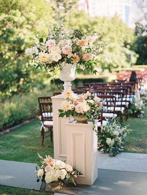 Flower Pedestals Wedding Aisle, Flower Pots For Wedding Ceremony, Wedding Ceremony Floral Urns, Top Wedding Flowers, Flowers On Columns Wedding, Floral Risers Wedding, Wedding Ceremony Podium Flowers, Ceremony Columns Wedding, Ceremony Urn Arrangements