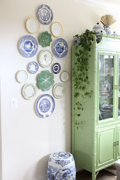 Christmas Decorations in Our New Home | Stripes and Whimsy Plates And Baskets On Wall, Plate Wall Bedroom, Chinoiserie Gallery Wall, Cabbage Plates On Wall, Kitchen Gallery Wall Farmhouse, Kitchen Wall Plates Decor, Blue Plate Wall, Wall Plates Decor Living Rooms, Hanging Plates On The Wall Ideas