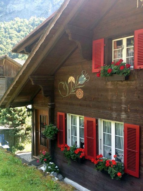 Saved Photo ￼ Brown House Red Trim, Heidi House Switzerland, Brown House With Shutters, Swiss Cabin Chalet Style, Switzerland House Cottages, Bavarian Cabin, Chalet Windows, Bavarian Cottage, Switzerland Decor