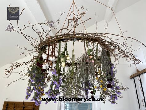 This floral chandelier would look amazing in a marquee or teepee for an enchanting and romantic wedding breakfast.  The flowers used in this design will dry over time and still look beautiful. Dried flowers will add a vintage, bohemian feel to any wedding. The flowers used are red roses, white roses, pink roses, lavender, statice, limonium, craspedia, cotton, hazel, contorted hazel. The colour palette used is dusty lilac and pink with a pop of colour from the deep red roses and yellow craspedia. Dried Flower Chandelier, Witch Business, Medieval Wedding Theme, Branch Ideas, Dried Flower Crafts, Wreaths Diy Easy, Goth Diy, Harvest Wedding, Chandelier Boho