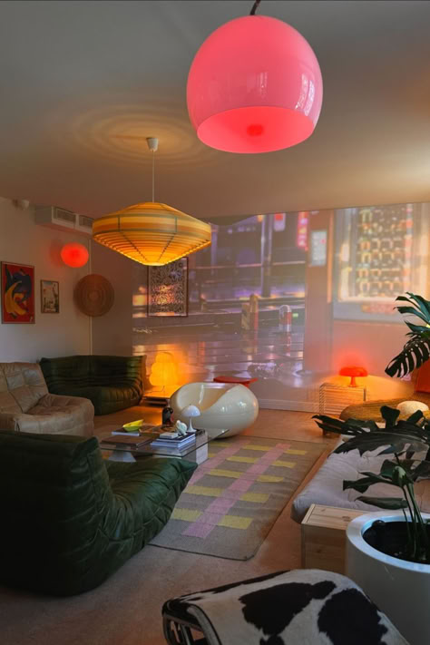 Dive into this vibrant and eclectic living room, where vintage charm meets modern flair. The mix of colourful lighting, retro furniture, and unique decor pieces create a playful yet cosy atmosphere. Perfect for those who love bold statements and a touch of nostalgia in their home decor. Explore Vinterior's living room edit and find your perfect piece. Image via goodeyesthetics. Eclectic Modern Decor, Funky Interior Design, Funky Eclectic Decor, Colourful Lighting, Funky Living Room, Modern Eclectic Home, Funky Living Rooms, Vintage Living Room Furniture, Colourful Living Room Decor