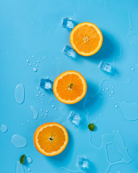 Three orange halves sit on a blue background - complementary colors Complementary Colors Examples, Aesthetic Orange, Wallpaper Estetika, Wallpapers Ideas, Wallpaper Homescreen, Fruit Wallpaper, Fruit Photography, Orange Aesthetic, Orange Wallpaper