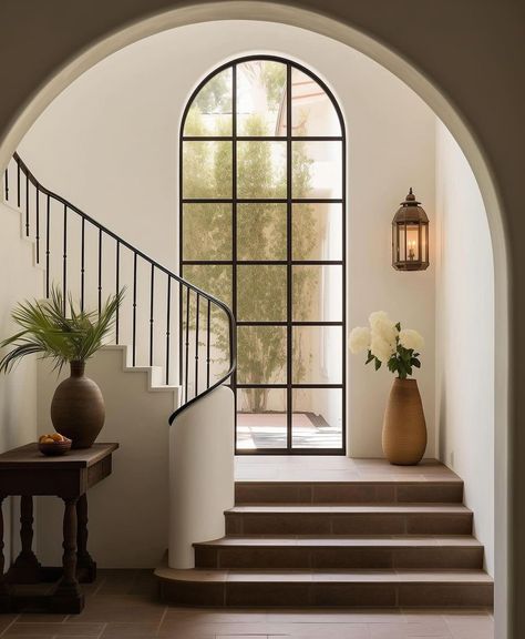 Spanish Villa Staircase, Art Deco Stairs Stairways, Classy House Aesthetic, Modern Tudor Home Interior, Beautiful Staircases Grand Entrance, House With Courtyard Entrance, Spanish House Design Interior, Spanish Architecture Interiors, Black And White Mediterranean House