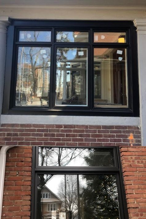 These modern black window frame contrasts well with classic brick. Provides an updated look to a dated fecade. Installed on homes in historic Toronto Canada by Delco Windows and Doors. Black Wood Windows, Black Window And Door Frames, Brick Home Black Windows, Black Grid Windows Exterior, Black Picture Windows Exterior, Black Windows Exterior Red Brick, Red Brick Home With Black Windows, Black Window Frames Exterior, Black Framed Windows Exterior