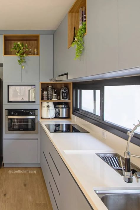 Discover the art of maximizing kitchen space with our smart corner cabinet ideas 🌿🍽️. This sleek design isn't just about saving space—it's about creating a flow that works for you. The blend of cool gray tones and warm wood details offers both function and form, turning a small corner into the heart of your home. Hungry for more ingenious kitchen hacks? Click to find out how to transform your kitchen corners into stylish, space-saving wonders! #GoTinySpace #CornerKitchenCabinetIdeas Shelves Layout, Pantry Rustic, Luxury Layout, Corner Kitchen Layout, Island Small Kitchen, Kitchen Layout Design, Luxury Houses Kitchen, Small Kitchen Layout, Island Layout