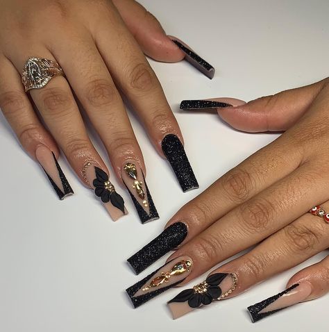 Glittery black slanted French tips with 3D flowers, gems, and rhinestones nail arts on long Nails Inspiration Baddie, Sparkly Black Nails, Hottest Nail Trends, Quince Nails, 3d Acrylic Nails, Quinceanera Nails, Gold Acrylic Nails, Acrylic Toe Nails, Black Acrylic Nails