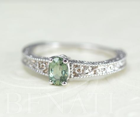 Exclusive to Benati. Green sapphire engagement ring with a antique vintage feel. Crafted to perfection in solid 14k white gold. A unique brilliant engagement ring with beautiful engraving and mill-grain details, this special engagement ring will make her blush. A brand new design inspired by the antique style I love so much. The center oval cut natural green sapphire gem is 6*4 approx. 0.50 carat. Made in the highest craftsmanship - crafted to perfection to a high polish. A unique and original e Green Wedding Rings, Green Engagement Rings, Brilliant Engagement Rings, Special Engagement Ring, Antique Wedding Bands, Original Engagement Rings, Green Sapphire Engagement, Green Sapphire Engagement Ring, Cute Engagement Rings