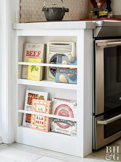 If you have a beloved collection of cookbooks, you have an easy kitchen decorating idea. Don't relegate them to a cabinet—put them on exhibit. The pretty covers will serve as artwork when arranged and layered facing outward on the shelves within an island or built into the side of a counter. Floating shelves on the walls are also an easy cookbook display solution—just make sure the shelves aren't too close to the sink or range so there isn't risk of a book falling into soapy water or onto a h... Cookbook Display, Normal Kitchen, Cookbook Storage, Clever Kitchen Storage, Narrow Shelves, Kitchen Clutter, Large Families, Diy Kitchen Storage, Classic Kitchen