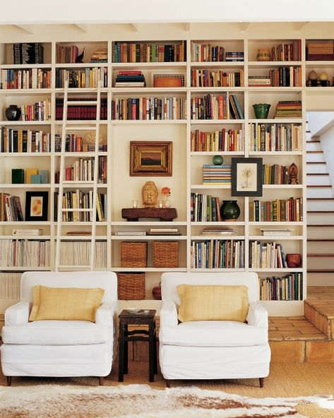 Elegant Arrangement These floor-to-ceiling bookcases are original to the house and hold various family objects such as woven baskets to keep family photos, book collections, and a display area. Book Shelf Styling, Floor To Ceiling Bookshelves, White Bookshelves, Bookshelf Organization, Room Library, Bookshelf Styling, Book Wall, Home Libraries, Built In Bookcase