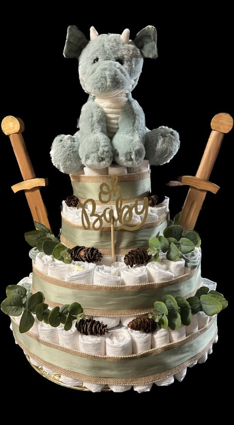 Lotr Gender Reveal, Baby Dragon Shower Ideas, Fantasy Gender Reveal, Dragon Diaper Cake, Mythical Baby Shower Theme, Baby Boy Dragon Nursery, Medieval Baby Shower Ideas, Dragon Gender Reveal, Dragon Baby Shower Cake