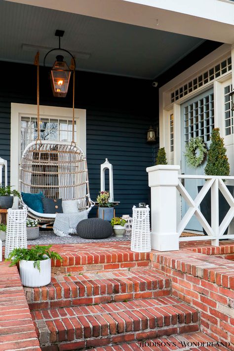 front-porch-swing-outdoor-decor-brick-steps-outdoor-lighting-plants-lanterns Light Blue House Exterior, Blustery Sky, Blue Exterior House Colors, Light Blue Houses, Brick Porch, Front Porch Steps, Front Porch Swing, Brick Steps, Paint Blue