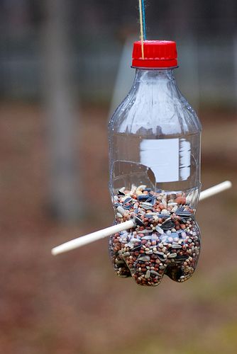 coke bottle bird feeder | Coke bottle bird feeder | Flickr Diy Bird Feeders Homemade, Diy Bird Feeder Kids, Homemade Bird Feeder, Make A Bird Feeder, Bird Feeder Craft, Backyard Getaway, Homemade Bird Feeders, Bird House Feeder, Hanging Bird Feeders