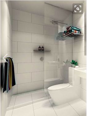 lovely large white tiles with grey grout so it doesn't show dirt Large White Tiles, Drømme Bad, White Subway Tile Bathroom, Small Bathroom Tiles, Subway Tiles Bathroom, White Bathroom Tiles, Toilet Sink, Small Showers, Bathroom Tile Designs