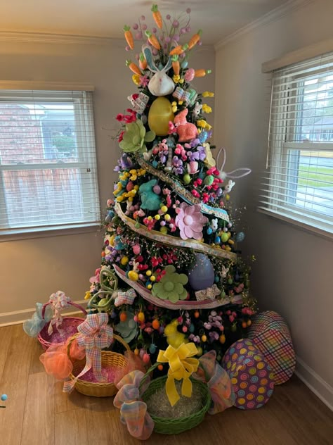 Christmas tree decorated for easter with faux flowers, lots of easter eggs, easter bunnies, rabbits, jelly beans, carrots, and ribbon! April Christmas Tree Ideas, Easter Trees Ideas, Spring Christmas Tree Ideas, Easter Christmas Tree Ideas, Christmas Tree All Year Round, Year Round Christmas Tree Ideas, Christmas Tree Year Round, Spring Christmas Tree, Easter Christmas Tree