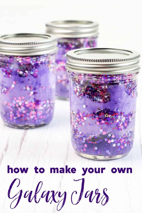 This fun and easy craft is perfect for space fanatics of all ages. With just a few simple supplies, you can create your own DIY galaxy in a jar. These gorgeous sensory jars are the perfect way to relax, calm down, and unwind. Stellar Craft Ideas, Space Rocks Craft, Galaxy Glitter Jar, Galaxy Crafts For Toddlers, Galaxy Jar Craft, Out Of This World Crafts, Galaxy Jars Diy For Kids Easy, Sensory Jars Diy, Calming Jars For Kids Diy