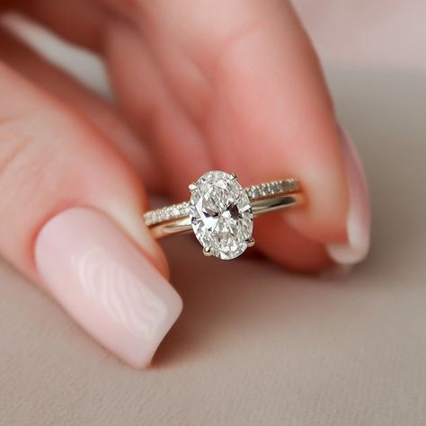 ENGAGEMENT RING DETAILS✧ Center Stone Weight: 1.50CTW (9*6MM)✧ Center Stone: Oval Cut✧ Center Stone Type: Moissanite✧ Side Stone Weight: 0.10CTW✧ Side Stone: Round Brilliant Cut✧ Moissanite Details: DEF Color, VVS+ Clarity✧ Band Width: Approx. 1.80MM WEDDING BAND DETAILS✧ Stone Weight: 0.40CT✧ Stone Cut: Round Brilliant✧ Stone Type: Moissanite✧ Moissanite Detail: DEF Color, VVS+ Clarity✧ Band Width: Approx. 1.80MM METAL DETAILS ✧ Metal: Solid Gold✧ Metal Purity: Available Options 10K | 14K | 18K Anniversary Ring Set, Moissanite Wedding Ring Set, Moissanite Engagement Ring Set, Oval Diamond Ring, Detailed Engagement Ring, Moissanite Engagement Ring Oval, Image 3d, Bridal Engagement Rings, Moissanite Wedding Rings