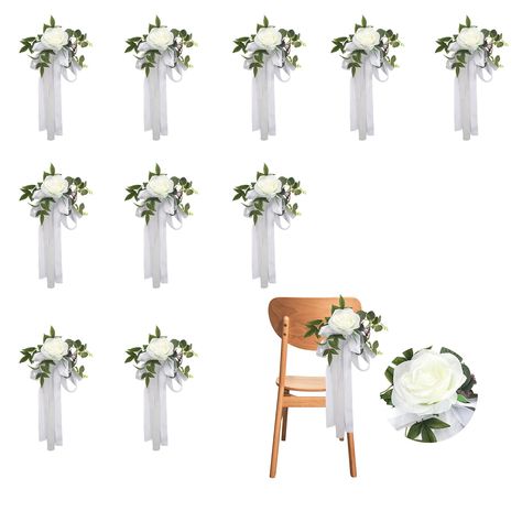 PRICES MAY VARY. PREMIUM MATERIALS: Experience the silky touch of our artificial roses, beautifully made from high-quality silk cloth, complemented by clear textured green leaves made of durable plastic for a lifelike and long-lasting appeal. EASY TO USE: Instantly add elegance to your party celebration by simply draping the artificial wedding aisle chair flower on the chair's back or tying it with a ribbon. EASY TO CLEAN: Maintaining our artificial wedding chair flowers is a breeze; it can be w White Flowers Wedding Ceremony, Wedding Aisle Chair Decor, Wedding Pew Decorations Church, Church Aisle Decorations Wedding, Pew Decorations Wedding, Church Decorations Wedding, Wedding Pew Decorations, Christ Centered Wedding, Church Aisle Decorations