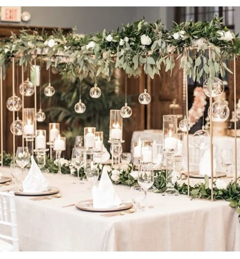 Hanging Wedding Centerpieces, Wedding Table Hanging Decorations, Overhead Wedding Centerpieces, Hanging Centrepieces Wedding, Hanging Orbs Wedding, Overhead Table Decorations, Statement Florals Wedding, Flowers Cascading Off Table, Over The Table Rod Decor Ideas