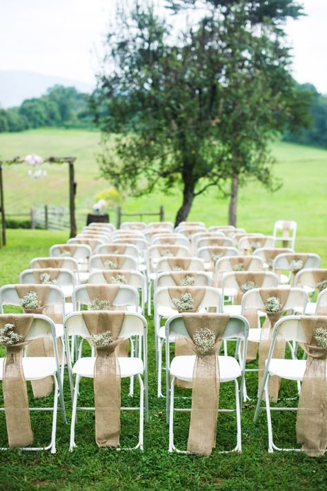 Inexpensive Folding Chairs: 16 Fabulous Ways to Decorate - CTC Event Furniture - CTC Event Furniture Wedding Ceremony Chairs, Rustic Burlap Wedding, Ceremony Chairs, Wedding Chair Decorations, Rustic Wedding Decorations, Chair Decor, בר מצווה, Burlap Wedding, Outside Wedding