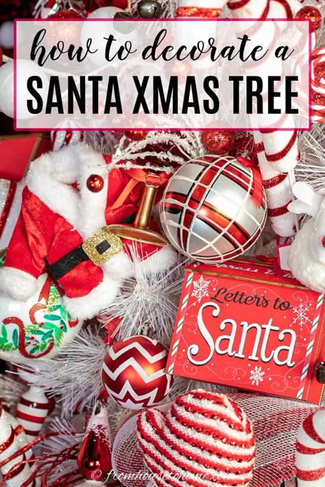 With red and white ribbon, Santa ornaments and picks and a Santa hat tree topper, this Santa Christmas tree theme is a fun and festive way to decorate for Christmas. Santa Clause Tree Theme, Red And White Santa Christmas Tree, Santa Inspired Christmas Tree, Diy Santa Tree Topper, Santa Hat Tree Topper Ideas, Santa Themed Christmas Tree Ideas, Santa Clause Christmas Tree Ideas, North Pole Christmas Tree Theme, Red Black And White Christmas Tree Ideas