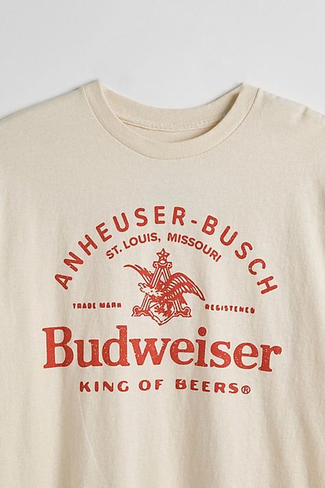 Tee with Budweiser graphics printed at the front. Cotton jersey t-shirt in a standard fit with short sleeves & a ribbed knit crew neck. Features Budweiser graphic tee Regular fit Short sleeves Crew neckline Content + Care 100% Cotton Machine wash Imported Size + Fit Measurements taken from size Medium Chest: 21" Length: 28" | Budweiser King Of Beers Tee in Ivory, Men's at Urban Outfitters Bar Shirt, College Shirts, Shirt Design Inspiration, Screen Printing Shirts, Shirt Print Design, Merch Ideas, Graphic Tees Vintage, Graphic Tee Design, Beer Shirts