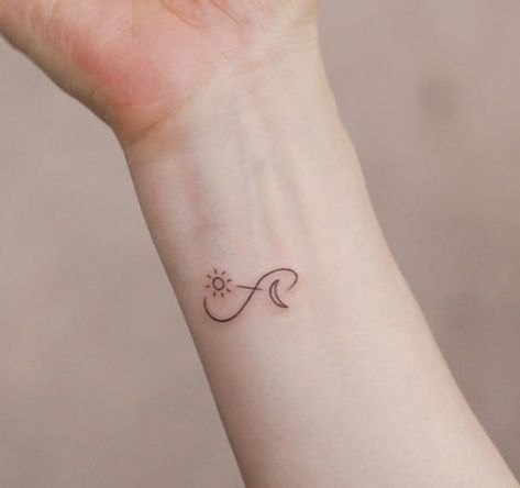 160+ Infinity Tattoo With Names, Dates, Symbols And More (For Women) Infinity Tattoo For Women On Wrist, Small Tattoos Infinity Sign, Sun Moon Infinity Tattoo, Sun Moon And Stars Infinity Tattoo, Mini Infinity Tattoo, White Infinity Tattoo, Infinity Sun Tattoo, Sun And Moon Infinity Tattoo, Cute Infinity Tattoos