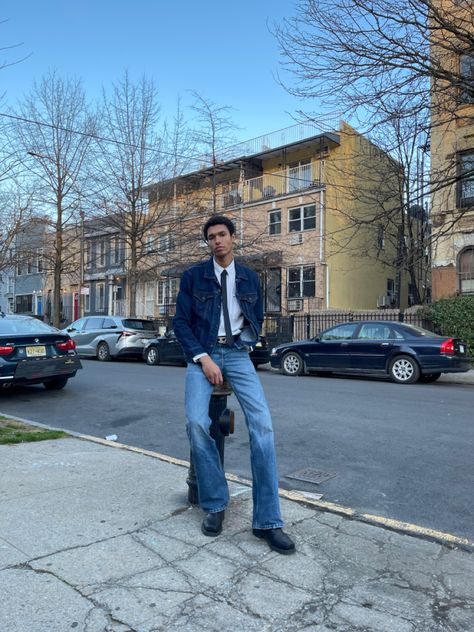 Lightskin model guy wearing an outfit with flare jeans pants, white shirt, jeans top, diesel belt and balck tie and boots Denim On Denim Outfit Men, Casual Tie Outfit, Work Shirt Outfit, Shirt And Tie Outfits, Tie Outfits Men, Jean Shirt Outfits, Diesel Belt, Denim Pants Outfit, Pant Flare