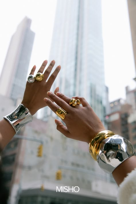 New York, New York! MISHO's creative director and founder, Suhani Parekh, touched town with the MISHO team in the big apple last week for our first pop up in NYC. Spotted here in the Hera Cuff, Bubble Rings, Pollux Cuff, Sirena Cuff, Flow Midi Ring, and Stackable Pebble Rings.  pinterest style, winter outfit, new york outfit, new york style, misho, statement jewellery #newyork #newyorkstreetstyle #nycstyle #streetstyle #statementjewellery #winterstyle #mixmetals Diamond Photoshoot, Jewelry Shoot Ideas, Photoshoot Jewelry, Bubble Rings, Jewellery Photoshoot, Jewelry Campaign, Golden Goose Sneakers Outfit, Shoes Golden Goose, New York Jewelry