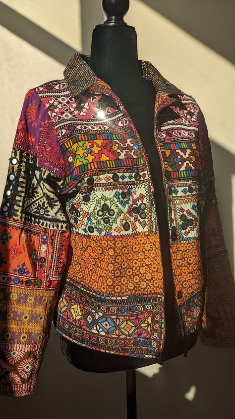 [Sponsored] This Patchwork Jacket Is Made Of Hand Embroidered Panels Stitched Together To Form A Boho Style Blazer. These Embroidered Patches Were Sourced From Tharparkar Region Of Sindh And Some Parts Of Balochistan. Each Section Of Embroidery Consists Of Different Styles Of Threadwork And Mirror Work Native To The Region, With Some Overlapping Techniques Of Baloch Styles. Some Of The Styles Of Embroidery Included Are But Not Limited To: Kaacha Taanka, #patchworkjacketsforwomen Gujrati Jackets For Women, Ralli Work, Patch Work Jacket, Patchwork Jackets For Women, Jacket Patchwork, Embroidery Jacket, Patchwork Coat, Work Blazer, Boho Jacket