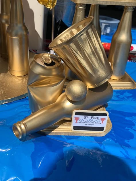 Beer Pong Tournament Outfits, Beer Trophy Diy, Beer Pong Trophy Diy, Fun Olympic Games For Adults, Beer Olympic Trophies, Beer Olympics Trophy Diy, Winter Beer Olympics Games, Birthday Beer Olympics, Beer Olympics Party Decorations